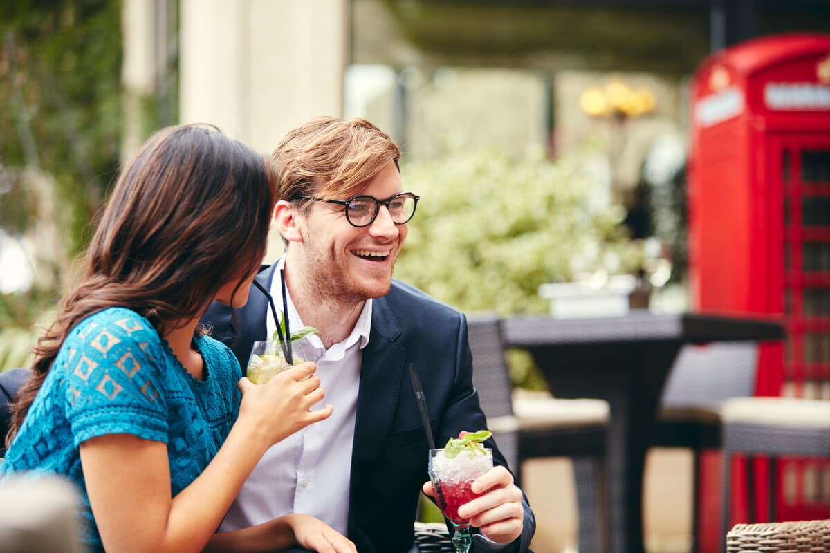 Couple Enjoying Cocktails on Terrace