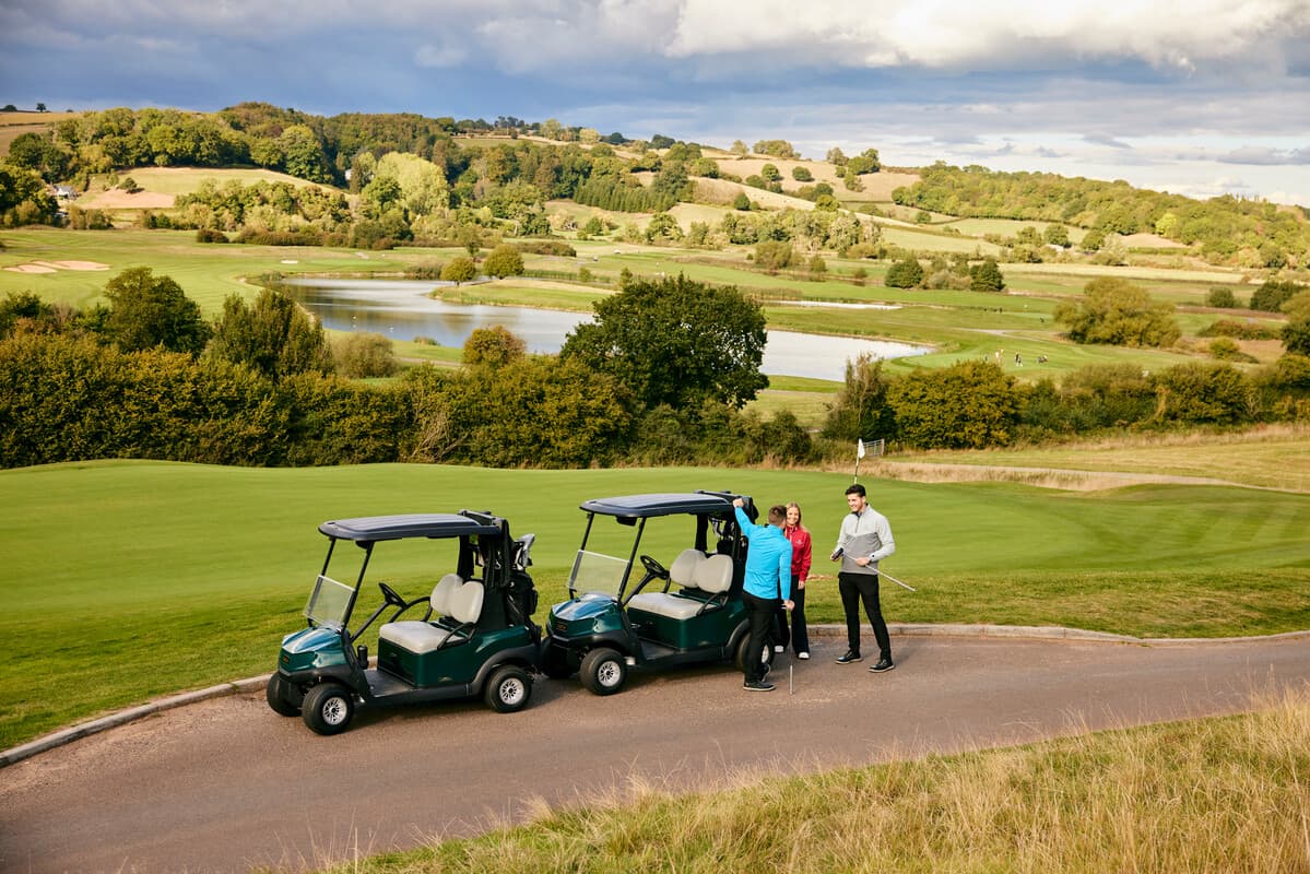 Golf Players on Course with Electric Buggy