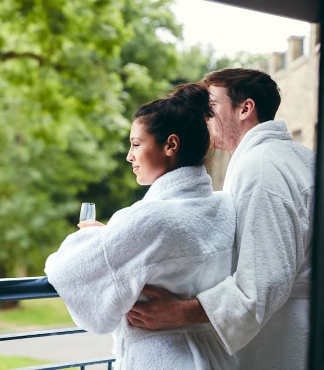 Couple on Balcony in Robes