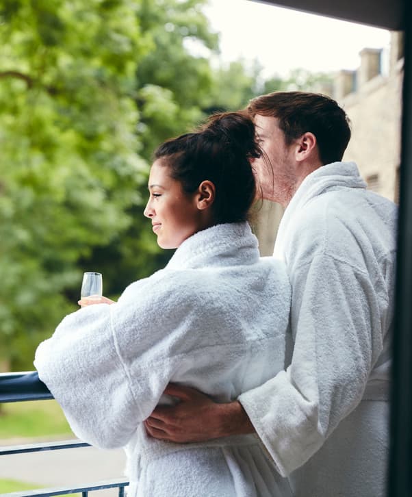Couple on Balcony in Robes