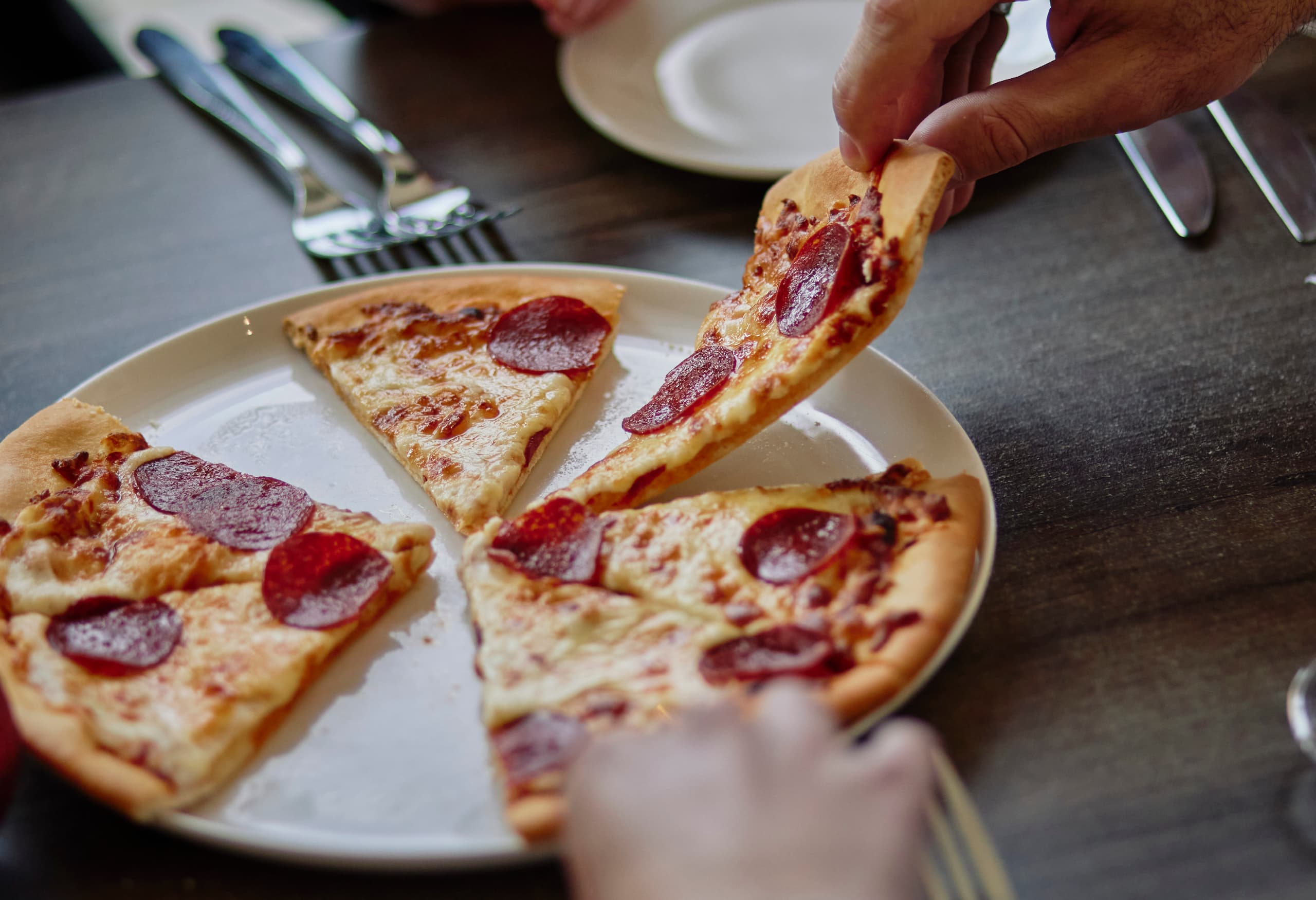 Group of friends sharing pizza